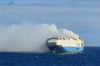 A cargo ship carrying 1,100 Porsches and 189 Bentleys caught fire off Portugal